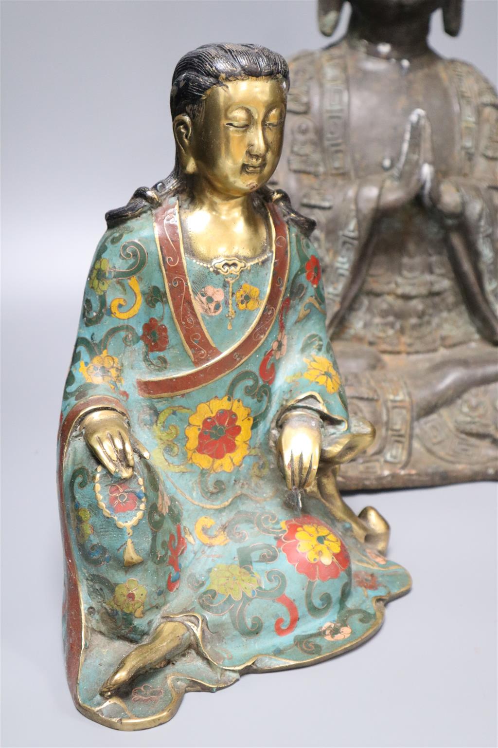 A large bronze Buddha, a Chinese cloisonne enamel figure and a hardstone vase and cover, tallest being 43cm high